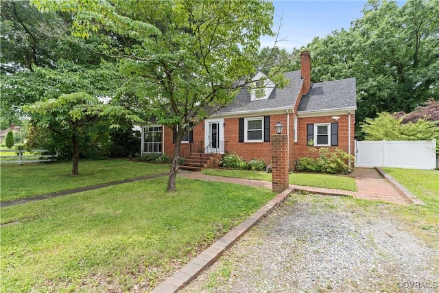 1012 Ridgecliff Dr, Richmond, VA 23224 - new england style home featuring brick siding, a chimney, and a shingled roof