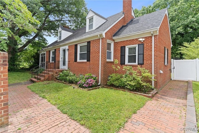 1012 Ridgecliff Dr, Richmond, VA 23224 - cape cod house featuring brick siding, a gate, a chimney, and a shingled roof