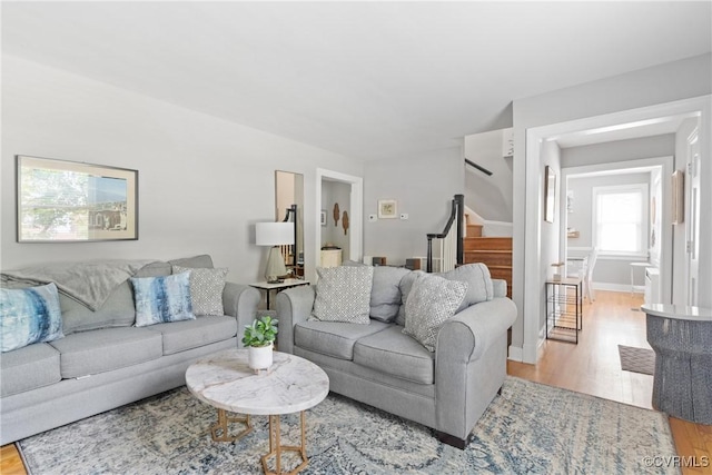 1012 Ridgecliff Dr, Richmond, VA 23224 - living area with light wood-style floors and stairway