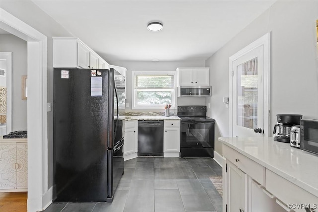 1012 Ridgecliff Dr, Richmond, VA 23224 - kitchen with black appliances, white cabinets, and light countertops
