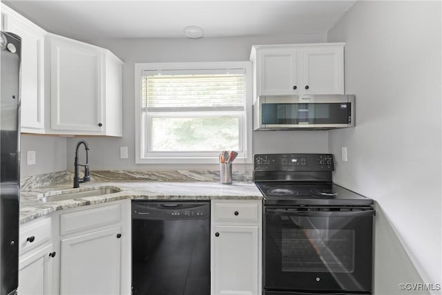 1012 Ridgecliff Dr, Richmond, VA 23224 - kitchen featuring black appliances, white cabinetry, and light stone countertops