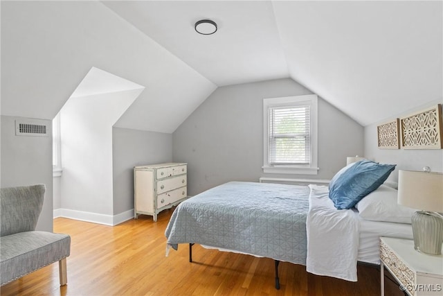 1012 Ridgecliff Dr, Richmond, VA 23224 - bedroom featuring light wood finished floors and vaulted ceiling