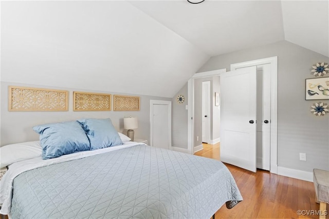 1012 Ridgecliff Dr, Richmond, VA 23224 - bedroom with vaulted ceiling and light wood-style flooring