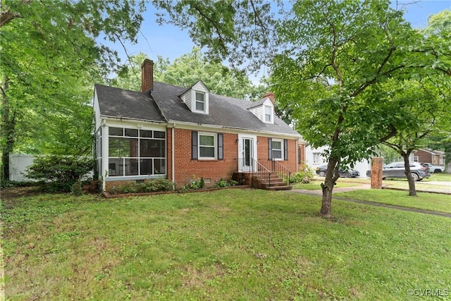 1012 Ridgecliff Dr, Richmond, VA 23224 - cape cod home with brick siding, a front yard, and a chimney