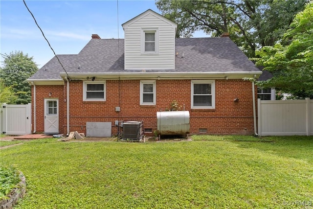 1012 Ridgecliff Dr, Richmond, VA 23224 - rear view of house featuring oil tank, brick siding, roof with shingles, and crawl space