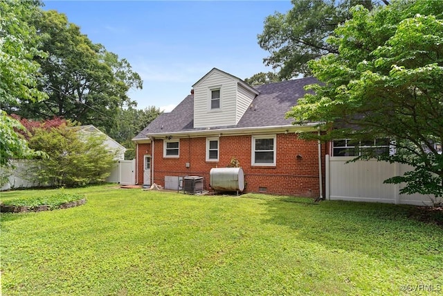 1012 Ridgecliff Dr, Richmond, VA 23224 - rear view of house with oil tank, brick siding, a shingled roof, and crawl space