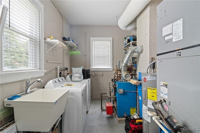 1012 Ridgecliff Dr, Richmond, VA 23224 - laundry area with heating unit, washing machine and clothes dryer, electric water heater, and a heating unit