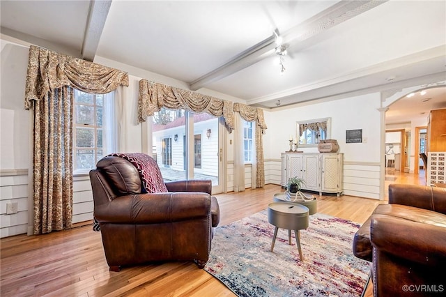 2821 Newquay Ln, North Chesterfield, VA 23236 - living area featuring beam ceiling, wood finished floors, arched walkways, and healthy amount of natural light