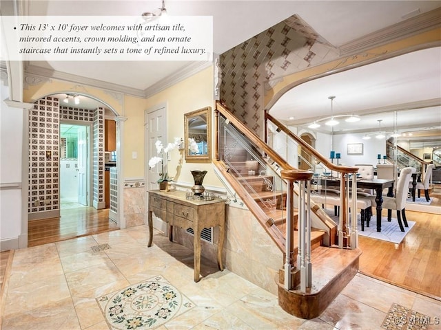 2821 Newquay Ln, North Chesterfield, VA 23236 - stairs featuring ornamental molding, arched walkways, and wainscoting