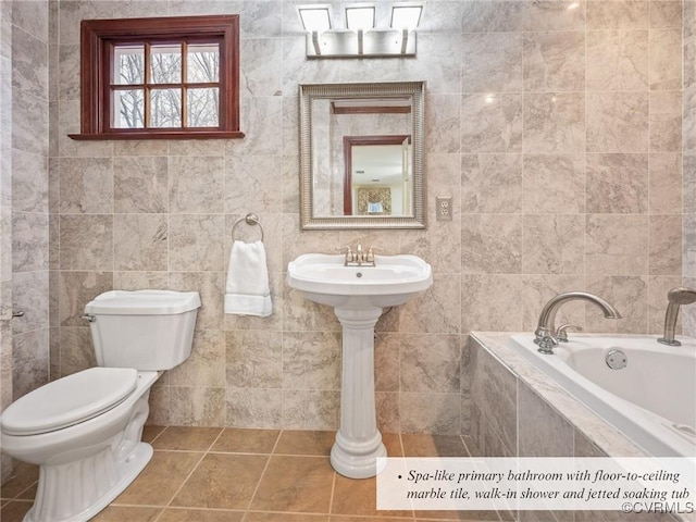 2821 Newquay Ln, North Chesterfield, VA 23236 - bathroom featuring a bath, tile walls, and tile patterned floors