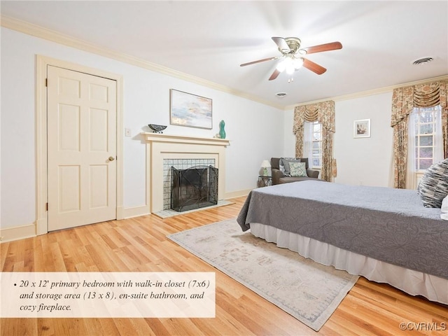 2821 Newquay Ln, North Chesterfield, VA 23236 - bedroom featuring multiple windows, wood finished floors, a tile fireplace, crown molding, and a ceiling fan