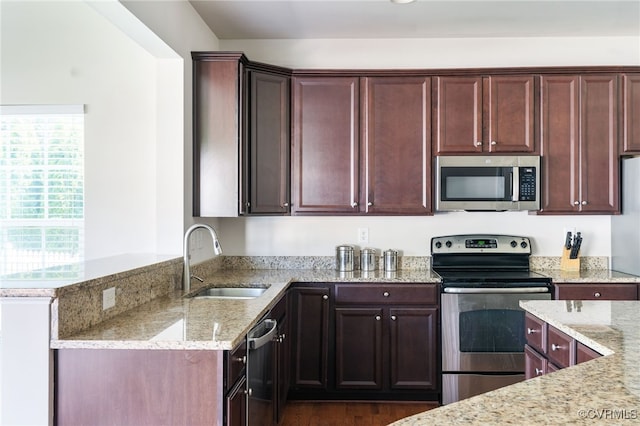 11012 Wingstem Ct, Glen Allen, VA 23060 - kitchen featuring appliances with stainless steel finishes, light stone countertops, dark wood-style flooring, and a peninsula