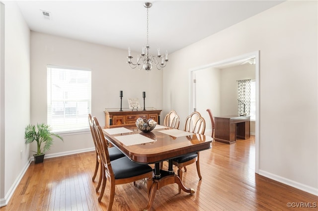11012 Wingstem Ct, Glen Allen, VA 23060 - dining area featuring light wood-style floors and a chandelier