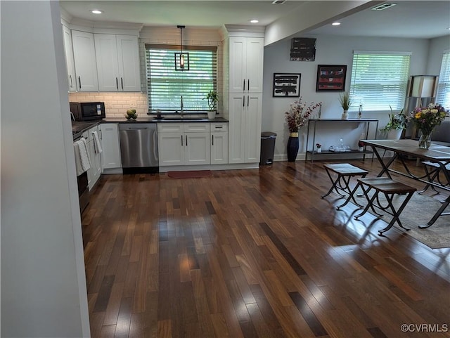 186 Piedmont Ave, Colonial Heights, VA 23834 - kitchen with dishwasher, black microwave, dark countertops, dark wood-style flooring, and tasteful backsplash