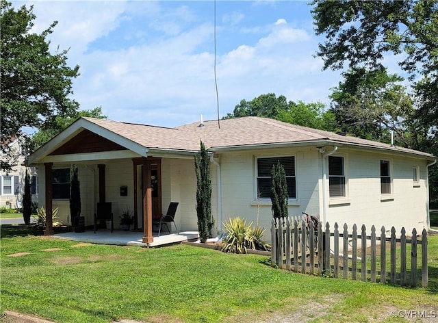 186 Piedmont Ave, Colonial Heights, VA 23834 - back of house with a shingled roof, concrete block siding, and a patio area