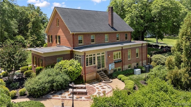 16520 Church St, Amelia Courthouse, VA 23002 - back of house featuring a chimney, brick siding, and entry steps