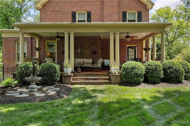 16520 Church St, Amelia Courthouse, VA 23002 - rear view of property with ceiling fan, brick siding, and a yard