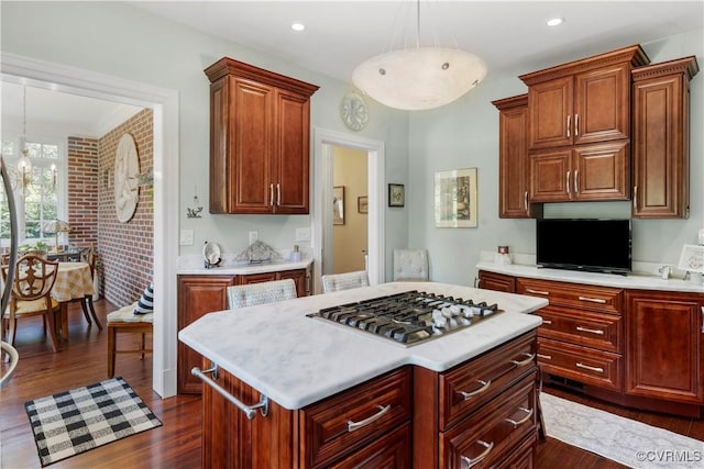 16520 Church St, Amelia Courthouse, VA 23002 - kitchen with stainless steel gas stovetop, light countertops, dark wood-style floors, hanging light fixtures, and a center island