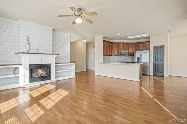 4133 San Marco Dr Unit 4133, Glen Allen, VA 23060 - unfurnished living room with a ceiling fan, wood finished floors, a glass covered fireplace, and recessed lighting