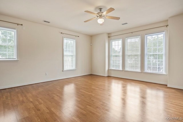 4133 San Marco Dr Unit 4133, Glen Allen, VA 23060 - unfurnished room featuring healthy amount of natural light, wood finished floors, and a ceiling fan