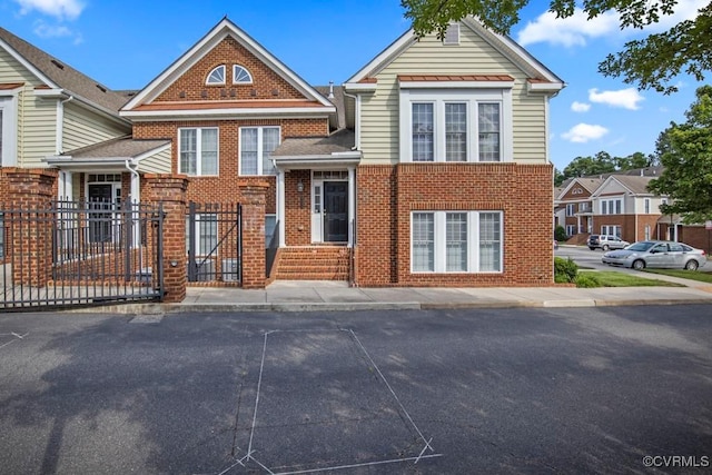 4133 San Marco Dr Unit 4133, Glen Allen, VA 23060 - view of front of house featuring brick siding and a gate