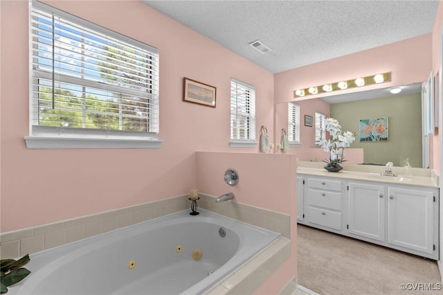 4855 Cypress Point Cir Unit 104, Virginia Beach, VA 23455 - bathroom with vanity, a tub with jets, and a textured ceiling