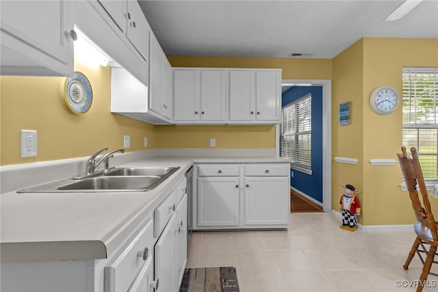 4855 Cypress Point Cir Unit 104, Virginia Beach, VA 23455 - kitchen featuring white cabinetry, light countertops, and light tile patterned flooring