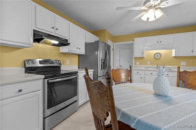 4855 Cypress Point Cir Unit 104, Virginia Beach, VA 23455 - kitchen with appliances with stainless steel finishes, under cabinet range hood, and white cabinetry