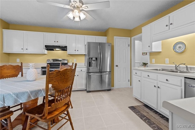 4855 Cypress Point Cir Unit 104, Virginia Beach, VA 23455 - kitchen with appliances with stainless steel finishes, under cabinet range hood, and light countertops