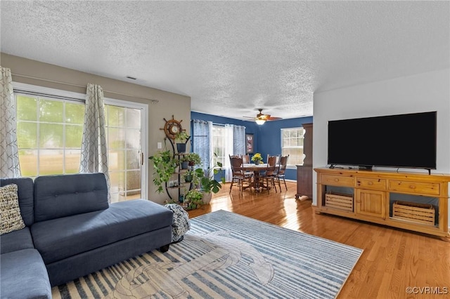 4855 Cypress Point Cir Unit 104, Virginia Beach, VA 23455 - living room with a textured ceiling, light wood-type flooring, and ceiling fan