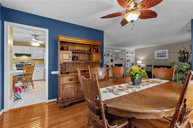 4855 Cypress Point Cir Unit 104, Virginia Beach, VA 23455 - dining area featuring ceiling fan, a textured ceiling, and light wood finished floors