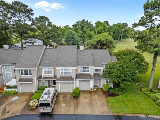 4855 Cypress Point Cir Unit 104, Virginia Beach, VA 23455 - view of front of house featuring driveway, an attached garage, a shingled roof, view of wooded area, and a front yard