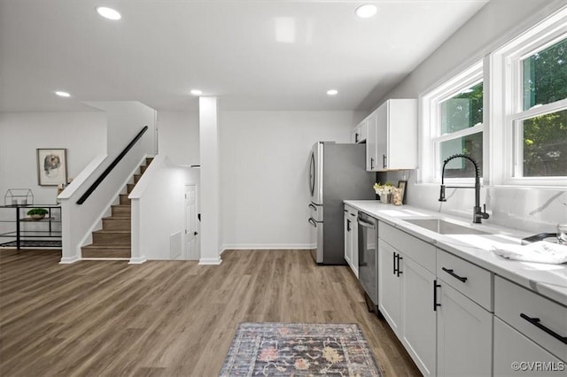 419 Marblethorpe Rd, North Chesterfield, VA 23236 - kitchen with appliances with stainless steel finishes, light countertops, light wood-style floors, white cabinets, and recessed lighting