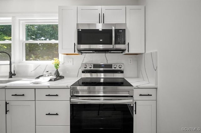 419 Marblethorpe Rd, North Chesterfield, VA 23236 - kitchen featuring stainless steel appliances, white cabinets, light stone counters, and decorative backsplash
