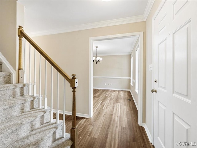 12213 Collinstone Pl, Glen Allen, VA 23059 - entrance foyer featuring wood finished floors, stairway, a chandelier, and ornamental molding
