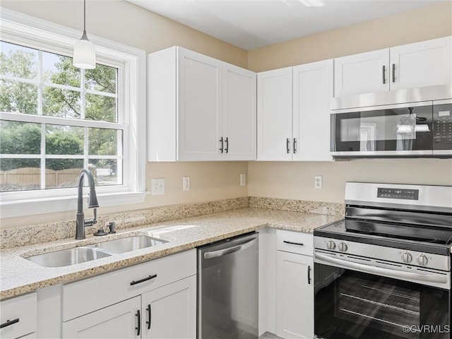 12213 Collinstone Pl, Glen Allen, VA 23059 - kitchen featuring appliances with stainless steel finishes, healthy amount of natural light, and white cabinetry