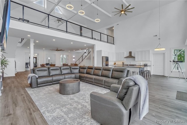 3315 Windmill Point Rd, White Stone, VA 22578 - living area with a high ceiling, a ceiling fan, and light wood-type flooring