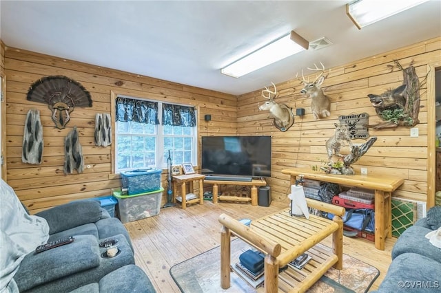 1305 Pea Ridge Rd, King & Queen, VA 23023 - living room featuring hardwood / wood-style floors and wooden walls