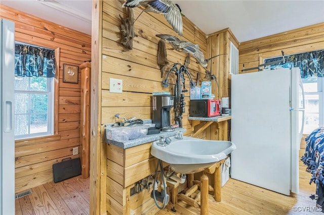 1305 Pea Ridge Rd, King & Queen, VA 23023 - bathroom featuring wood finished floors and wood walls