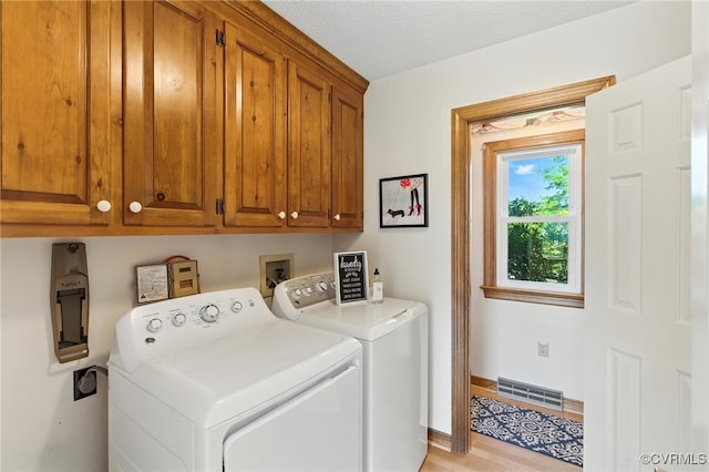 8346 Hanover Grove Blvd, Hanover, VA 23111 - washroom featuring cabinet space, independent washer and dryer, and light wood finished floors
