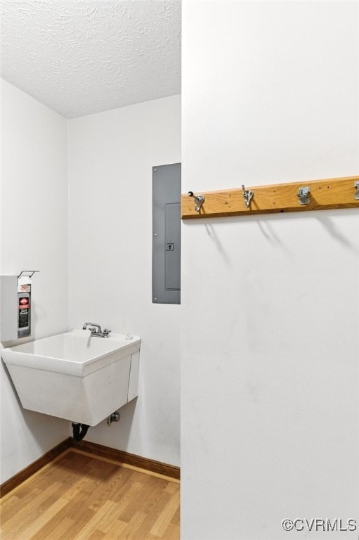 8346 Hanover Grove Blvd, Hanover, VA 23111 - bathroom featuring electric panel, wood finished floors, and a textured ceiling