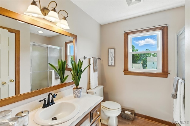 8346 Hanover Grove Blvd, Hanover, VA 23111 - bathroom with vanity, a shower stall, and wood finished floors