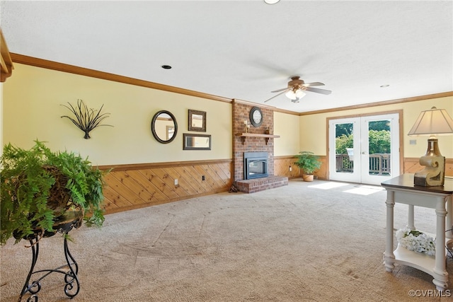 8346 Hanover Grove Blvd, Hanover, VA 23111 - unfurnished living room featuring wainscoting, ceiling fan, carpet, wooden walls, and crown molding