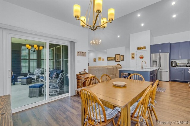 12 Essie Ct, Irvington, VA 22480 - dining area with a chandelier, wood finished floors, recessed lighting, and vaulted ceiling