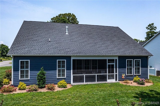 12 Essie Ct, Irvington, VA 22480 - rear view of house featuring a yard, roof with shingles, and a sunroom