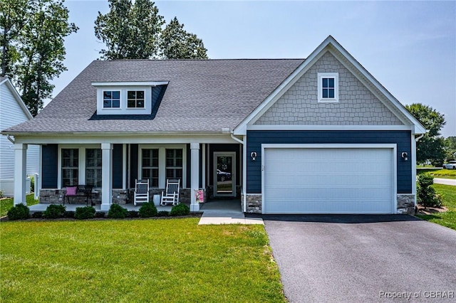 12 Essie Ct, Irvington, VA 22480 - craftsman house with stone siding, a porch, driveway, and a front lawn