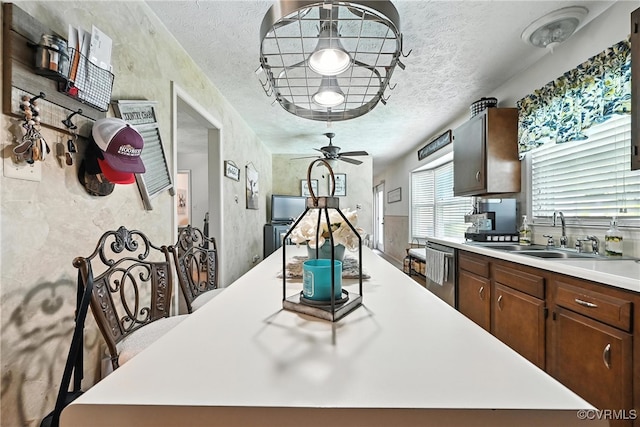 4901 Green Run Dr, Henrico, VA 23228 - kitchen featuring stainless steel dishwasher, light countertops, a textured ceiling, ceiling fan, and a center island