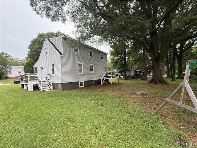 411 Sherman Ave, Hopewell, VA 23860 - view of property exterior with a lawn, stairway, and a deck