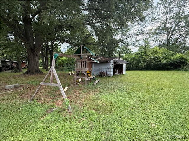 411 Sherman Ave, Hopewell, VA 23860 - view of grassy yard featuring a playground