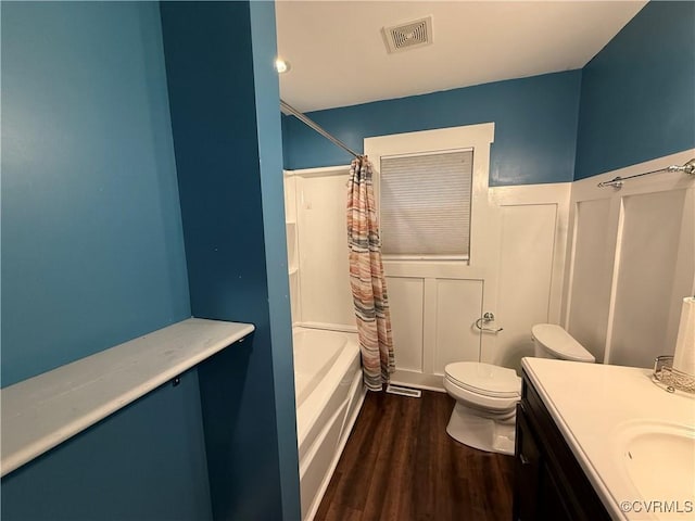 411 Sherman Ave, Hopewell, VA 23860 - bathroom with wood finished floors, shower / bath combo, vanity, and a wainscoted wall